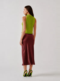 Back view of the SABLYN Miranda Bias Cut Silk Skirt in Cabernet showing the fluid drape to the hem