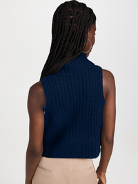 Back view of the Saige Cropped Turtleneck in Midnight Navy by SABLYN, featuring ribbed knit texture