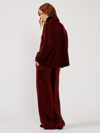 Side back view of the SABLYN Scarlett Slouchy Mock Neck Sweater in Cabernet showing the drop shoulder