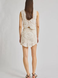Back view of the Vada Crochet Top in ivory by SAINT ART with cutout detail and textured crochet pattern