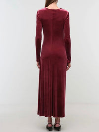 Back view of the SIMKHAI Ferrera velvet midi dress in Lipstick showing the long sleeves.
