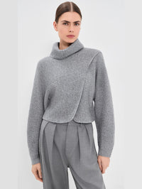 Front view of the SIMKHAI Orlienne asymmetrical turtleneck sweater in Grey Melange.