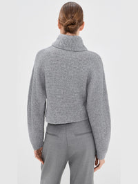 Back view of the SIMKHAI Orlienne ribbed turtleneck sweater in Grey Melange.