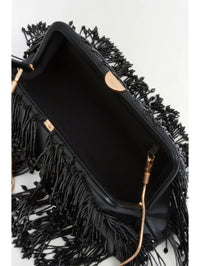 Interior view of the SIMKHAI Pia Beaded Fringe Clutch in Black showing the lining and snake chain clasps.