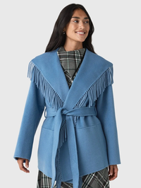Front view of the Rowen Fringe Jacket in dusty blue by Simkhai with layered fringe trim