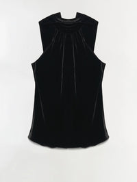 Back flat view of the SIMKHAI Scarlett Draped Velvet Cape Top in Black showing the gathered cape drape.