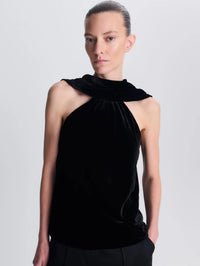 Close front view of the high gathered neckline on the SIMKHAI Scarlett Draped Velvet Cape Top in Black.