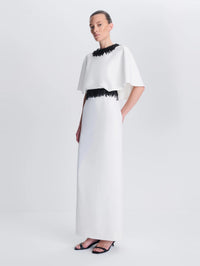 Side angle of the SIMKHAI Vantrel Short Sleeve Gown in Ivory showing the cape sleeve and beaded waist.