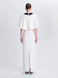 Back view of the SIMKHAI Vantrel Short Sleeve Gown in Ivory showing the cape, beaded collar, and center back zip.