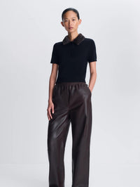 Front view of the SIMKHAI Vayla Wool Cashmere Polo in Black Chocolate Multi, cropped fit on model.
