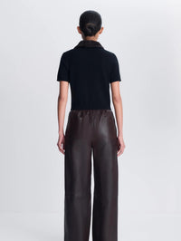 Back view of the SIMKHAI Vayla Wool Cashmere Polo in Black Chocolate Multi on model.