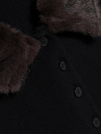 Detail of the faux fur collar and button placket on the SIMKHAI Vayla Wool Cashmere Polo in Black Chocolate Multi.