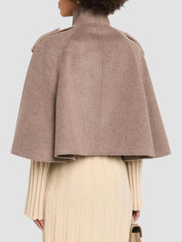 Back view of the SIMKHAI Yara Cape Jacket in Mushroom Melange showing the wide cape drape.