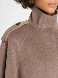 Collar and epaulette detail of the SIMKHAI Yara Cape Jacket in Mushroom Melange wool blend.
