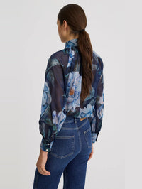 Back view of the SMYTHE Navy Floral Gathered Blouse showing the sheer cotton chiffon and button cuffs.