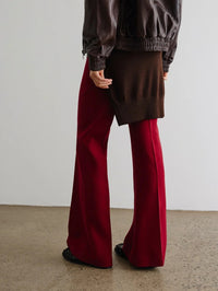 Back styled view of the SMYTHE Classic Pant in Garnet Fleck with a brown knit and leather jacket