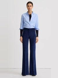 Full-length front view of the SMYTHE Sapphire Corduroy Wide Leg Trouser with a light blue oxford shirt.