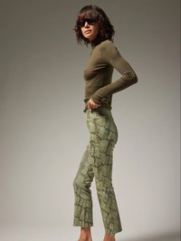 Side view of the SPRWMN Anaconda Green snakeskin leather ankle flare showing the kick flare