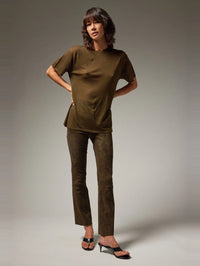 Full length front view of the SPRWMN Suede Ankle Flare in Loden with a tonal tee