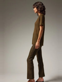 Side profile of the SPRWMN Loden suede ankle flare showing the subtle kick flare