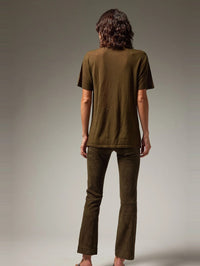 Back view of the SPRWMN Suede Ankle Flare in Loden on a model