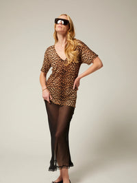 Full length view of the SPRWMN Tissue V Neck Tee in Jaguar styled over a sheer black slip skirt