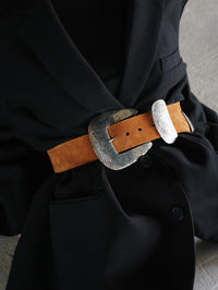 Close view of the Braun Belt in tan suede cinched over a black blazer, Streets Ahead