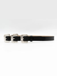 Angled view of the Streets Ahead Multi Silver Buckle Belt in black showing the strap tip