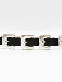 Close-up of the hammered silver buckles on the Streets Ahead Multi Silver Buckle Belt in black