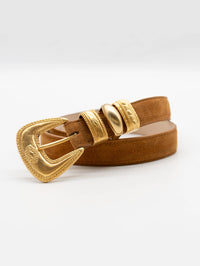 Coiled view of the Streets Ahead Sienna Belt in tan suede with gold hardware