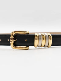 Close-up of the gold buckle and two-tone keepers on the Streets Ahead belt in black leather