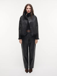 STUDIO AR Mallow Faux Fur Jacket in Dark Grey worn with the smooth side out and fur trim at the edges