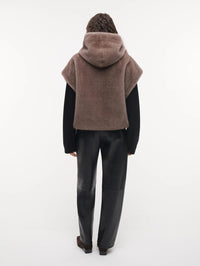 Back view of the STUDIO AR Olena Reversible Faux Fur Gilet in Pebble showing the hood