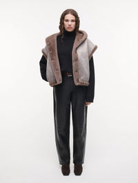 STUDIO AR Olena Reversible Faux Fur Gilet in Pebble worn reversed with the smooth side out and fur trim