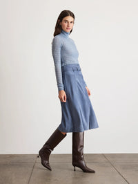 Side view of the Tanya Taylor Beacon Skirt in Morning Fog showing the A-line shape and midi length.