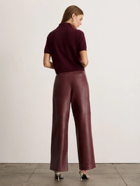 Back view of the Tanya Taylor Weston Leather Pant in Mahogany showing the seamed seat and full-length leg.