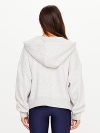 Back view of the Jude Crop Hoodie in Grey Marle by THE UPSIDE with drawstring hood