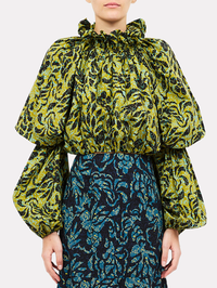 Front view of the Beatriz Long Sleeve Cotton Blouse in chartreuse with bold black swirled pattern by Ulla Johnson