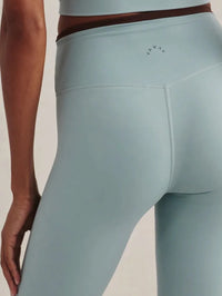 Back close-up of the Varley Always Contrast High Rise Legging 25 in Tourmaline with contrast waistband