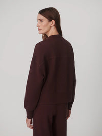 Back view of the Varley Olwen Button Front Sweater in Deep Mahogany with yoke seam