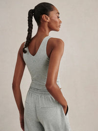 Back view of the Varley Ruby Cropped Tank in Blue Green Marl showing the V-back and cropped length