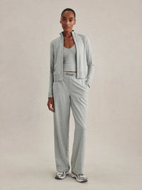 Full-length view of the Varley Rufus Cropped Zip-Through Sweat in Blue Green Marl worn open