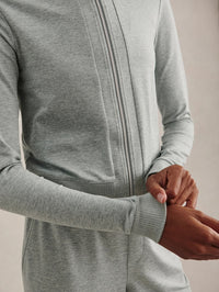 Close-up of the zip and ribbed cuff on the Varley Rufus Cropped Zip-Through Sweat in Blue Green Marl