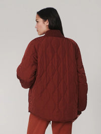 Back view of the Varley Serina Reversible Quilt Jacket in Cherry Mahogany with wave quilting