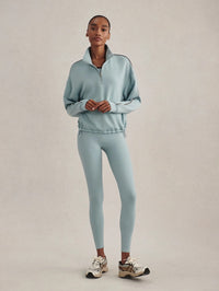 Full-length view of the Varley Sian Piped Half-Zip Sweat in Tourmaline with matching leggings