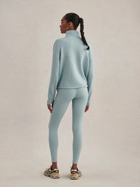 Full-length back view of the Varley Sian Piped Half-Zip Sweat in Tourmaline