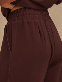 Close-up of the high-waisted smocked waistband on the Extra Wide Leg Pant in Deep Mahogany by VARLEY