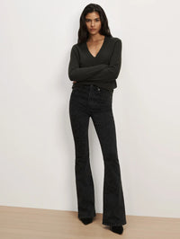 Front full-length view of the Veronica Beard Beverly Embroidered Skinny-Flare Jean in Washed Onyx on a model