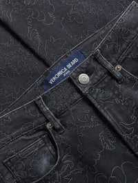 Close-up of floral embroidery and waistband on the Veronica Beard Beverly Embroidered Skinny-Flare Jean in Washed Onyx