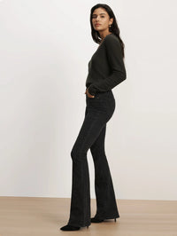 Side full-length view of the Veronica Beard Beverly Embroidered Skinny-Flare Jean in Washed Onyx